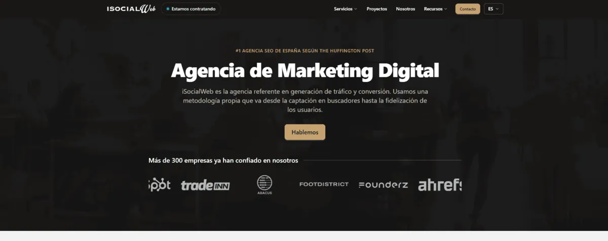 iSocialWeb home page with client logos such as Tradeinn and Ahrefs